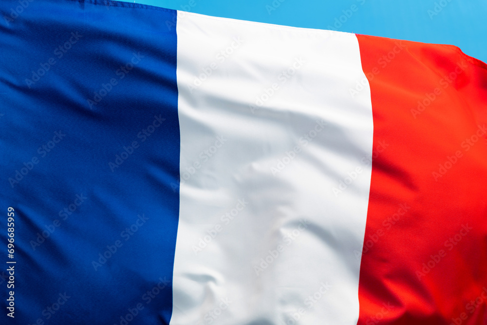 French flag waving on blue background French flag waving on blue background