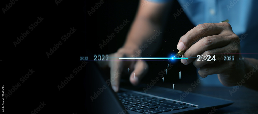 Countdown to 2024 concept. the taps a virtual download bar with a ...