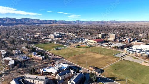 Sports fields at Colorado State University (CSU)  college campus  with student housing dorms and mountains in the background. Fort Collins, Colorado, USA photo