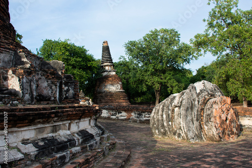 Ancient ruins ubosot ordination hall and antique old ruin stupa chedi for thai people traveler travel visit respect myth mystical in Wat Maheyong temple at Historic Heritage site in Ayutthaya Thailand photo