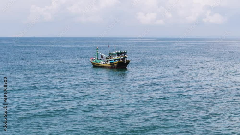 Vietnamese fisherman boat in open sea, aerial view