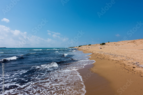 The gorgeous sandy beach of Issos in Corfu island, Greece photo