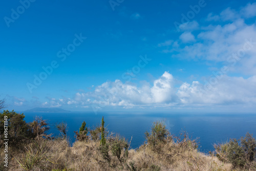 Stunning view down to the sea and the surrounding area from top of the mountain in Ereikoussa island, Greece photo