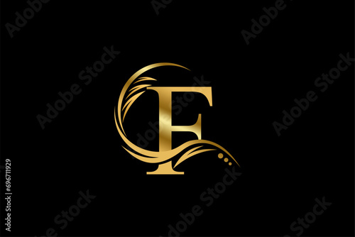 
Gold letter F logo design with beautiful leaf, flower and feather ornaments. initial letter F. monogram F flourish. suitable for logos for boutiques, businesses, companies, beauty, offices, spas, etc photo