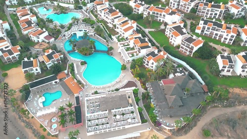 Aerial view of a luxury hotel along the coast Hotel Princess Fuerteventura, Canary Islands, Spain. Amazing Esquinzo beach in the background and Atlantic Ocean. photo