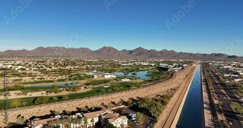 Drone View of Golf Course,  Mountains in Background. McDowell Mountain Range in Scottsdale, Arizona photo