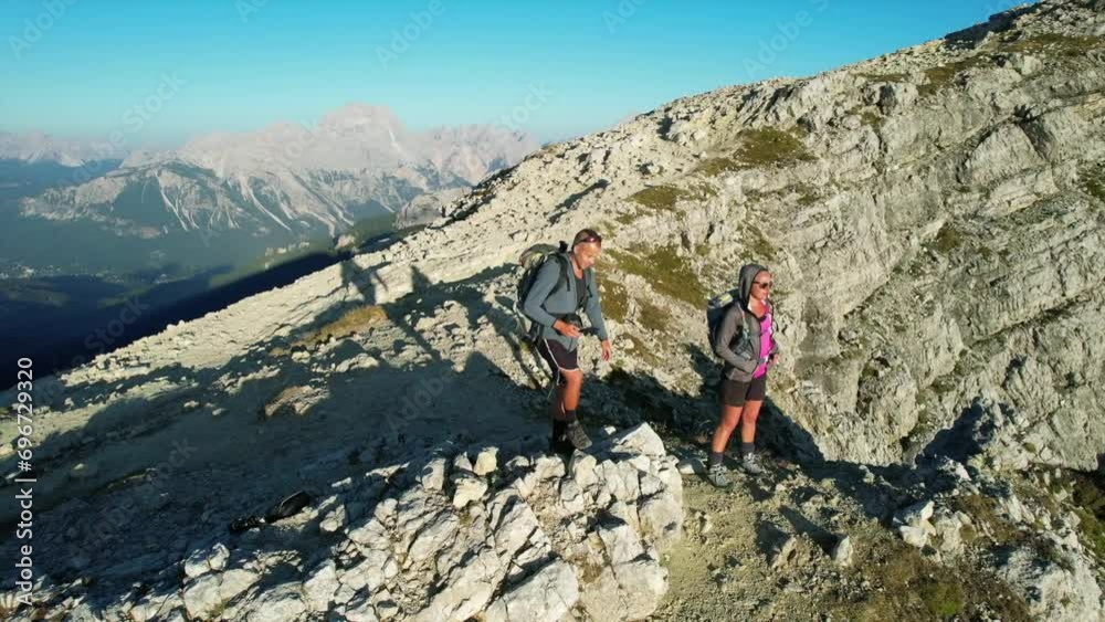 Hikers hiking the Dolomite mountains of northern Italy Hikers hiking the Dolomite mountains of northern Italy