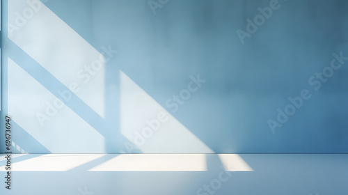 blue wall and smooth floor with beautiful window shadow and sun glare. Universal background for product presentation.