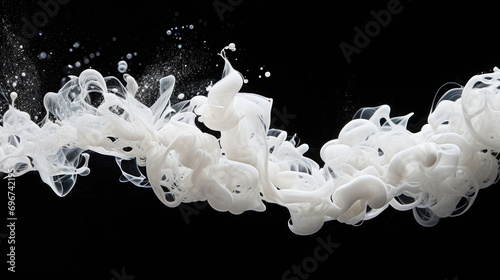 Intricate swirls of white liquid against a black background