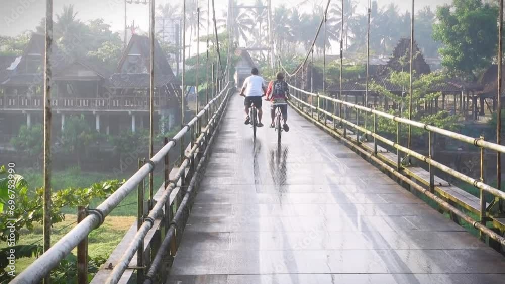 Crossing the bridge on bicycle Crossing the bridge on bicycle