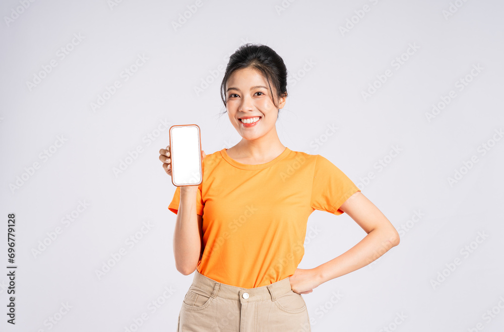 Portrait of cheerful happy Asian woman posing on white background Portrait of cheerful happy Asian woman posing on white background