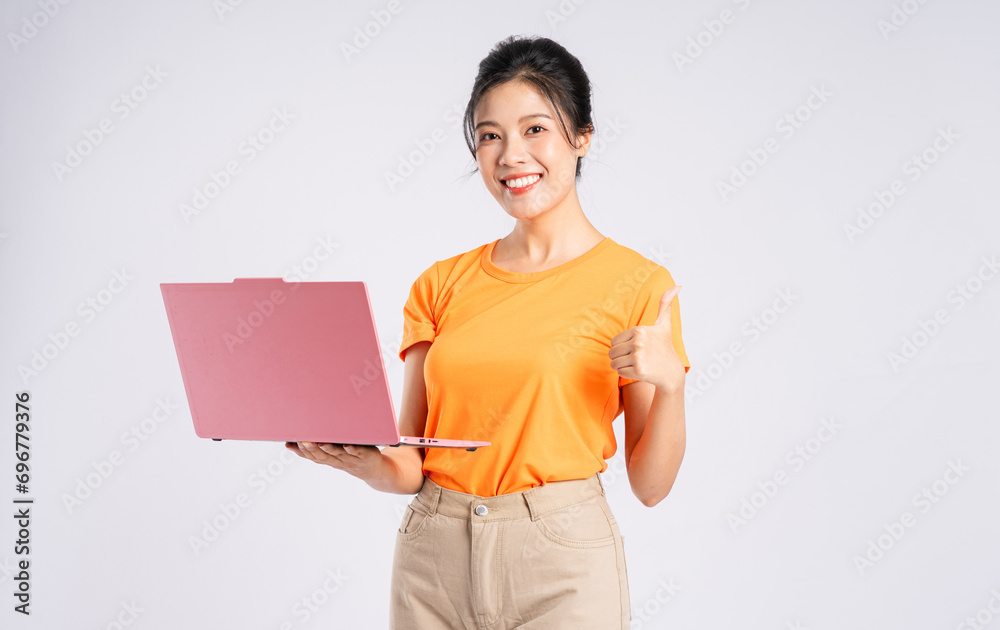 Portrait of cheerful happy Asian woman posing on white background Portrait of cheerful happy Asian woman posing on white background