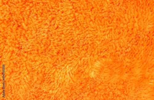 Orange Colored Fur Fabric Background with Copy Space in Horizontal Orientation