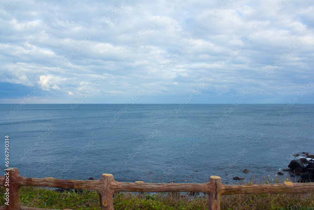 
Wooden fence and Jeju seascape.