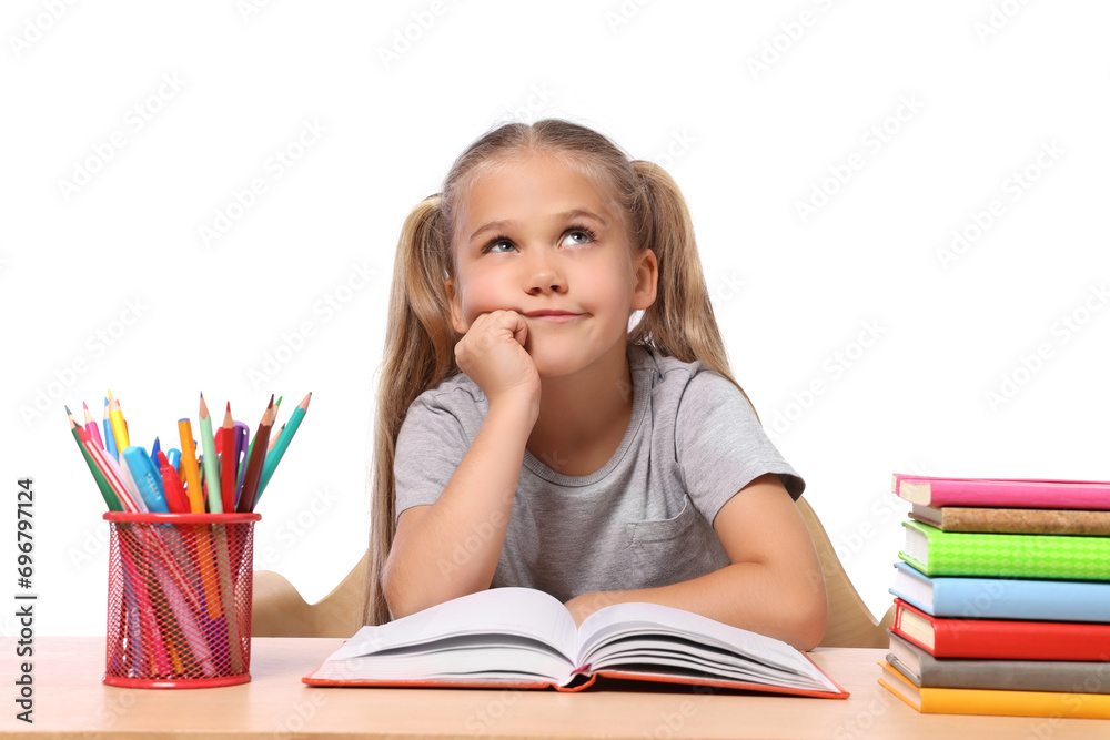 Little girl with stationery and books suffering from dyslexia at wooden table Little girl with stationery and books suffering from dyslexia at wooden table