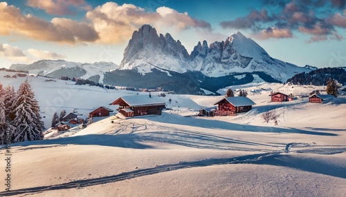 panoramic morning view of alpe di siusi village majestic winter sunrise in dolomite alps superb landscape of ski resort ityaly europe beauty of nature concept background photo