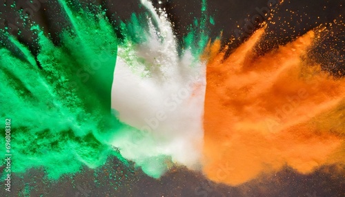 colorful irish tricolour flag in green white orange color holi paint powder explosion isolated background ireland europe celebration soccer fans travel tourism concept