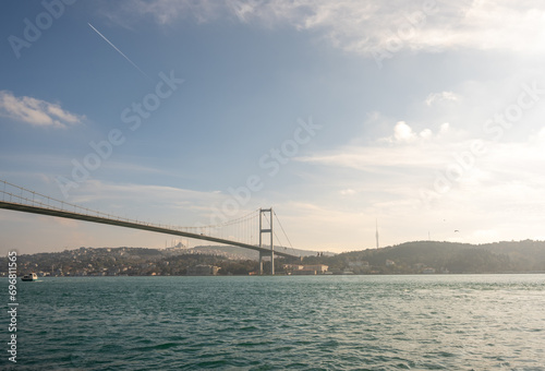 Wide angle shot of the Bosphorus and the Bosphorus Bridge. Istanbul Bosphorus view and city silhouette. Istanbul, Turkey photo