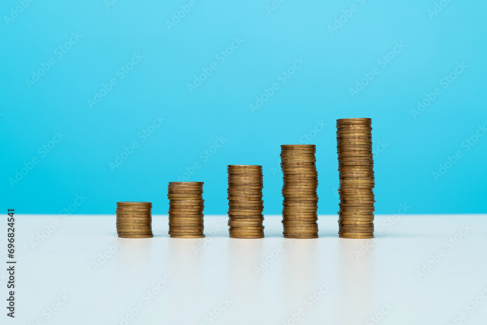 Golden coin stacks on the table Golden coin stacks on the table