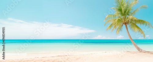 tropical beach and palm tree on clear blue sea horizontal background. travel, tourism and vacation concept, large copy space for text, add, card or wallpaper © XC Stock