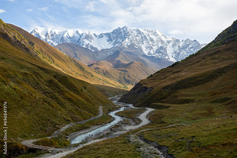View of the mountain valley, Mount Shkhara at dawn. View of the mountain valley, Mount Shkhara at dawn.