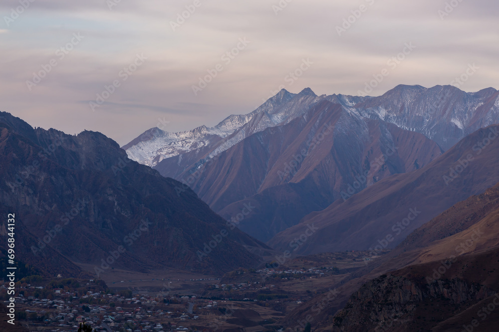 Fototapeta premium Caucasus mountains at sunset, dramatic landscape