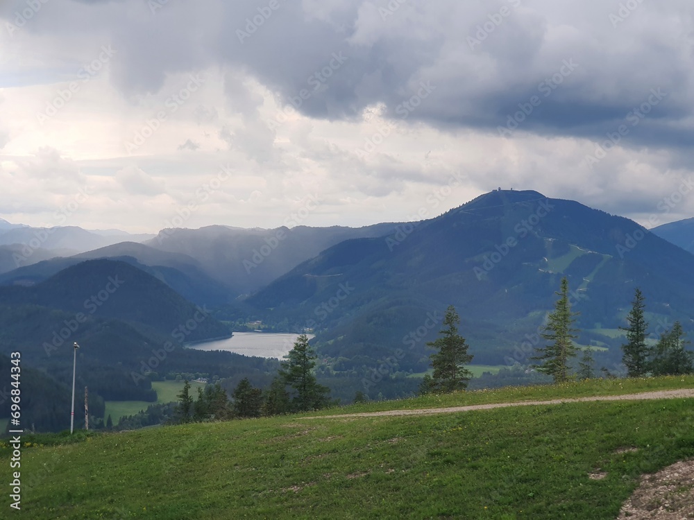 Wonderful mountain landscape in austria: Idyllic Ötscherland with swimming lake Erlaufsee in the valley and Gemeindealpe peak, austria. Holiday and travel concept