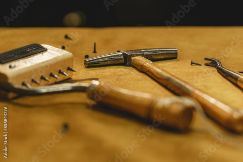 upholstery reparation tools on the wooden table 