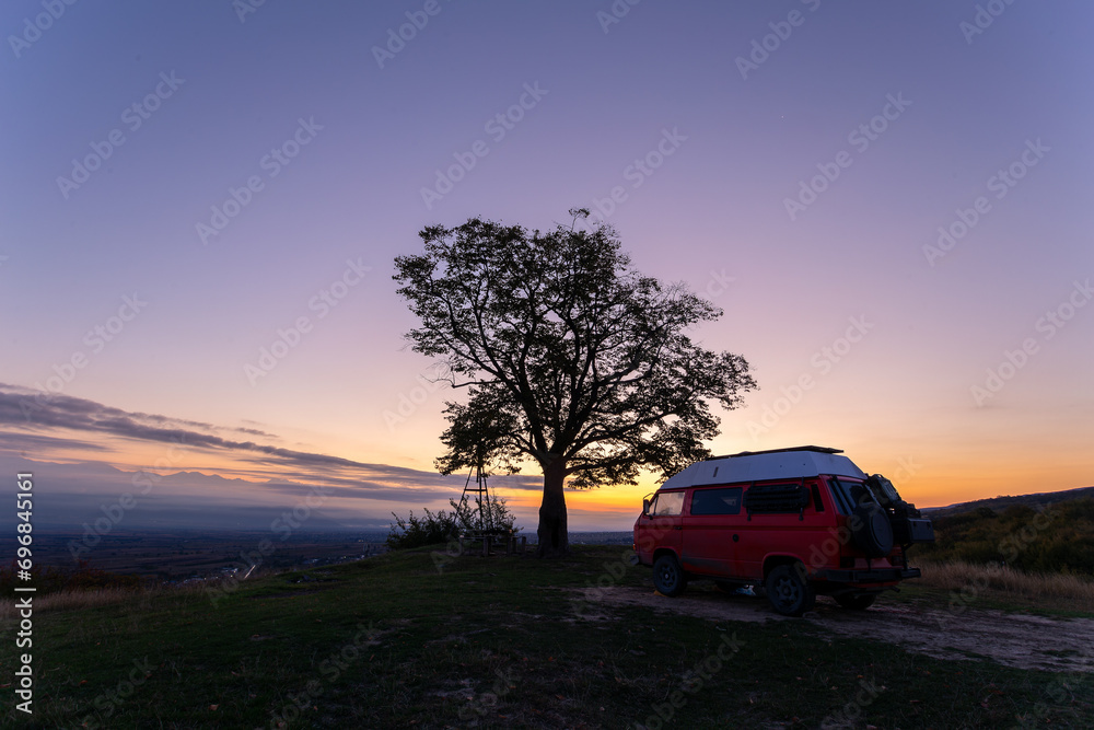 minibus camper at dawn in the mountains