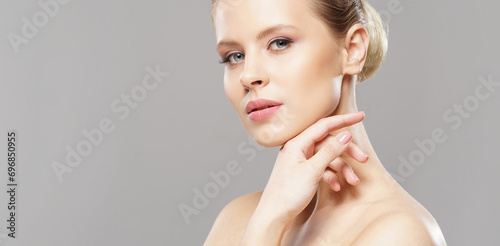 Close-up portrait of beautiful, fresh, healthy and sensual girl over grey background