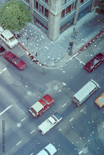 December 31, 1989 view of traffic at Grand Ave and 6th Street in downtown Los Angeles, California.  Papers on side walk was thrown from building windows in celebration of New Years Eve. photo