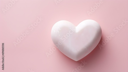Top View of a White Stone Heart on a blush Background. Romantic Template with Copy Space