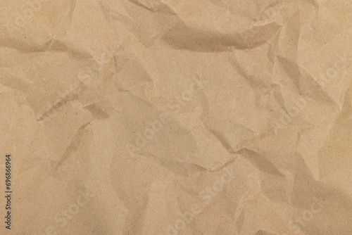 Texture of crumpled craft paper. Paper background.