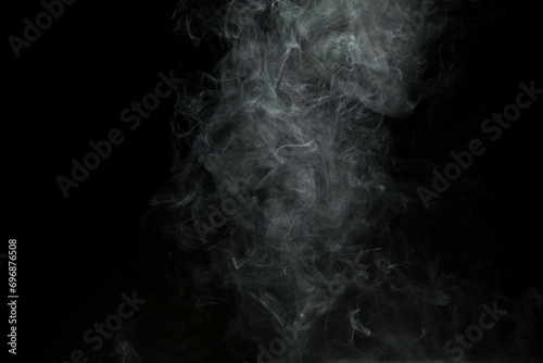 Abstract smoke misty fog on isolated black background. Texture overlays. Design element.