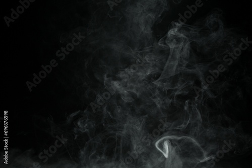 Abstract smoke misty fog on isolated black background. Texture overlays. Design element. photo