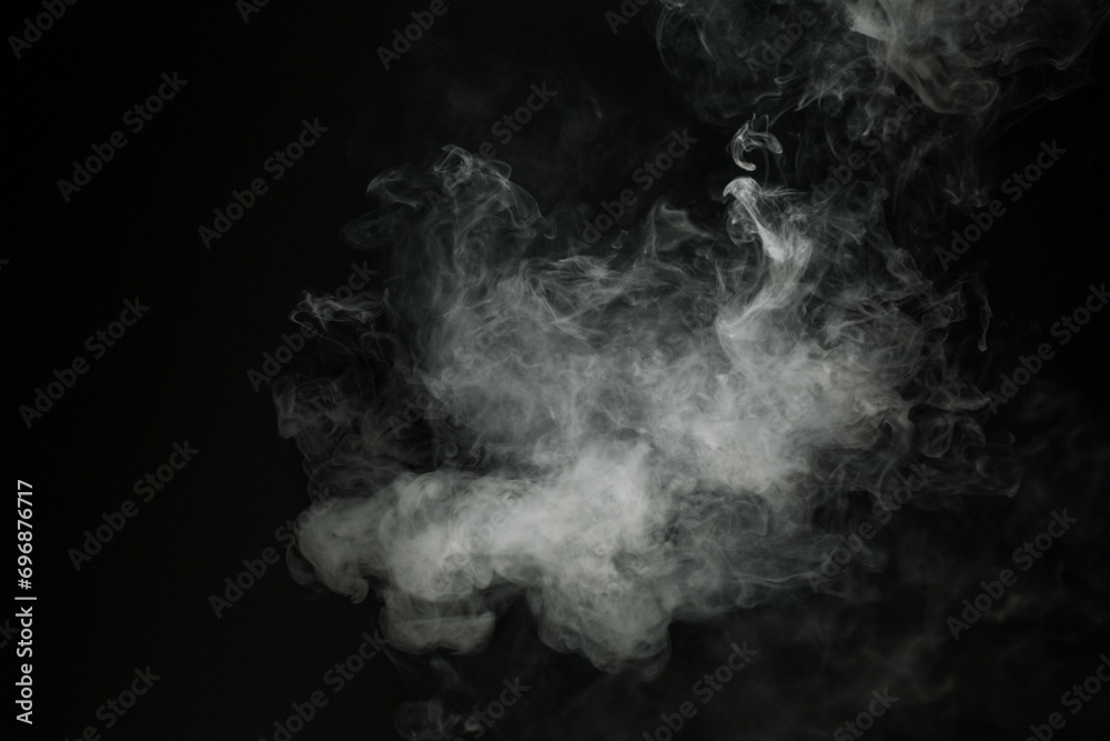 Abstract smoke misty fog on isolated black background. Texture overlays. Design element. Abstract smoke misty fog on isolated black background. Texture overlays. Design element.