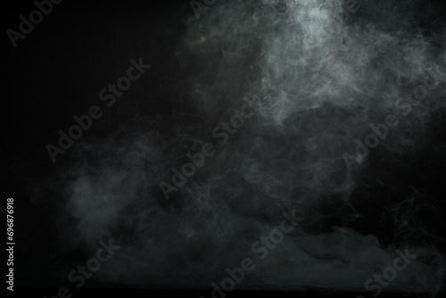 Abstract smoke misty fog on isolated black background. Texture overlays. Design element. photo