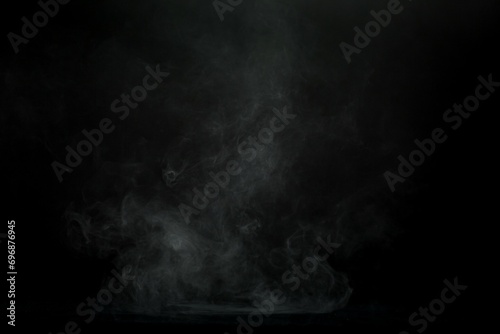 Abstract smoke misty fog on isolated black background. Texture overlays. Design element.