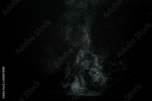 Abstract smoke misty fog on isolated black background. Texture overlays. Design element.