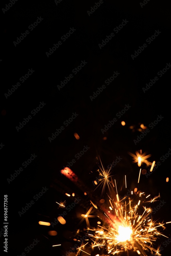 Obraz premium Perfect fire particles embers sparks on black background . Texture overlays.