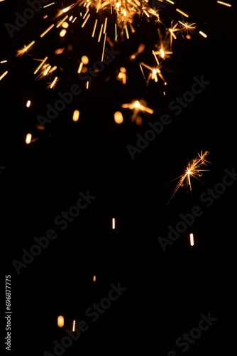 Perfect fire particles embers sparks on black background . Texture overlays.