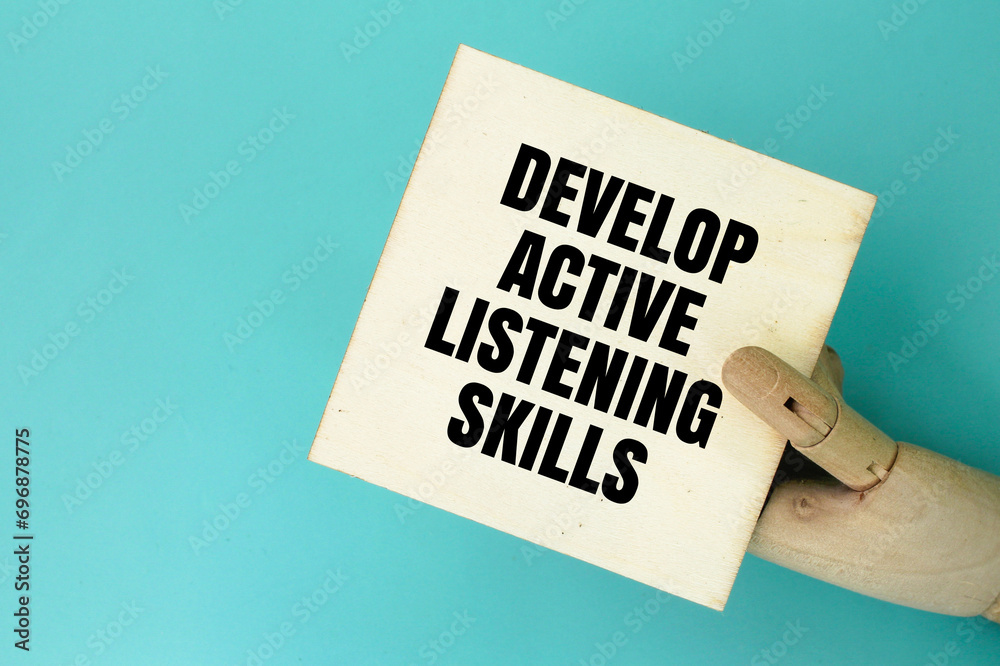 hand holding a board with the words Develop active listening skills ...
