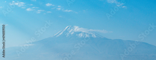 snow covered mountain peak ararat in end of summer in yerevan on clear day