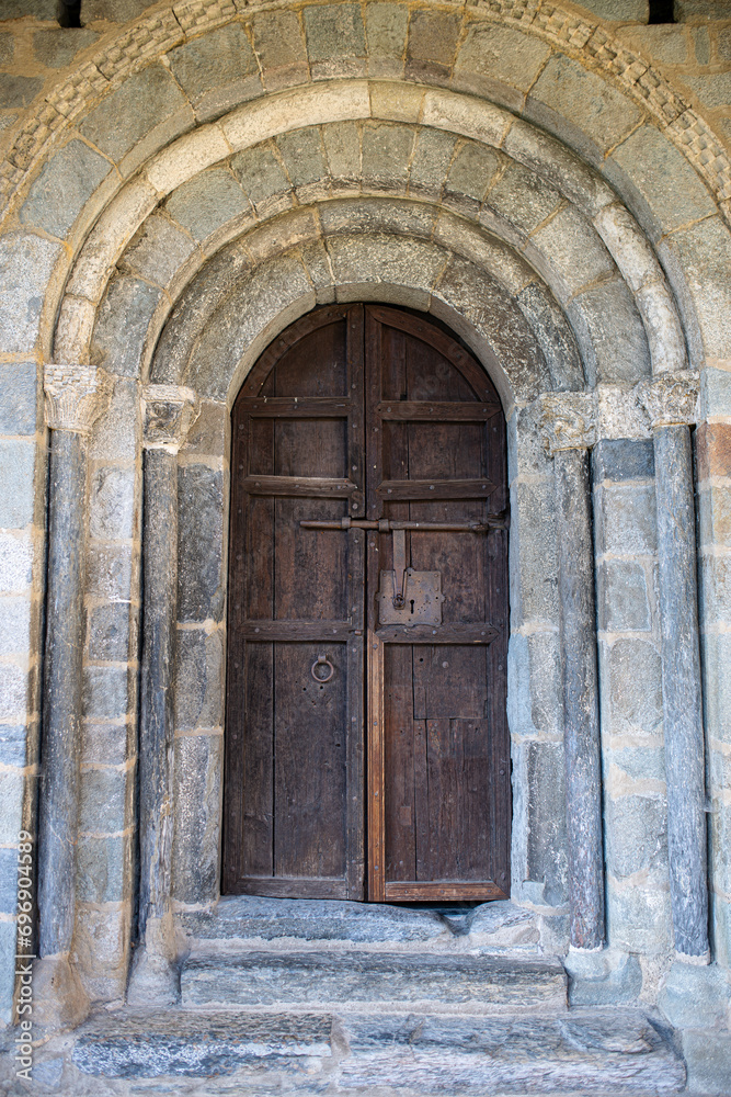 Wooden door of the Church of the Nativity of Durro, in the Bo? Valley, Lleida, Catalonia, Spain.