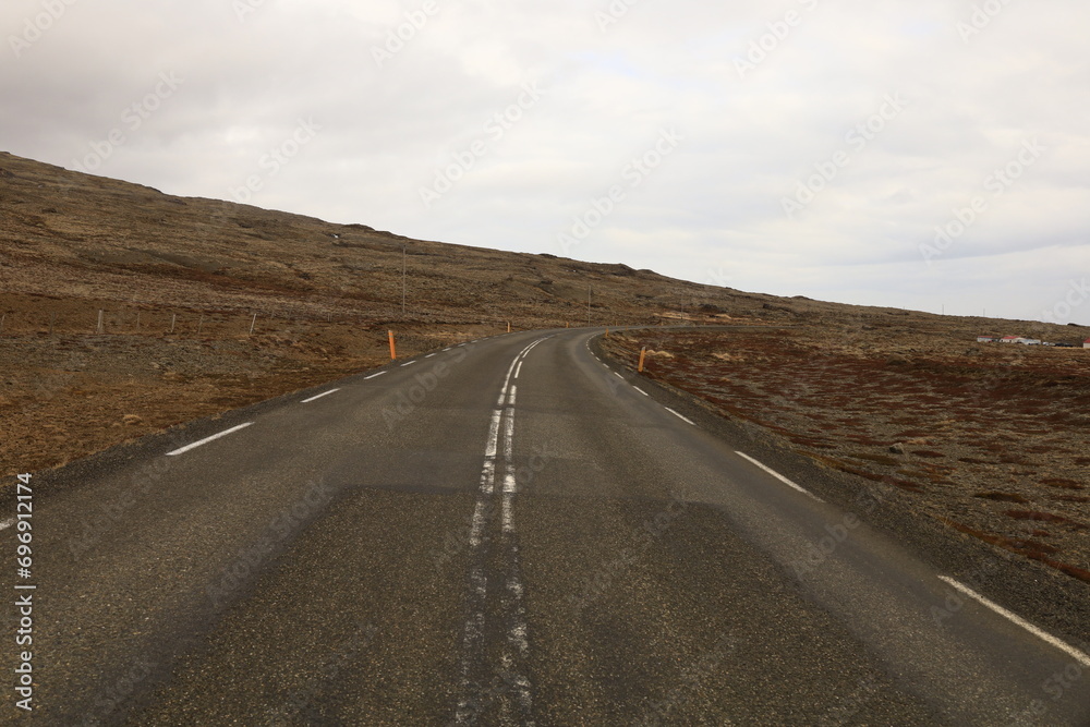 View on a road in in the north of island, in the region of Norĭurland eystra. View on a road in in the north of island, in the region of Norĭurland eystra.
