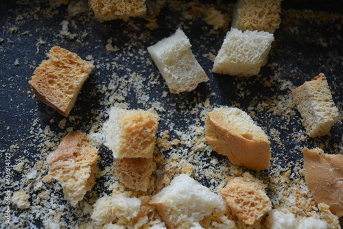 Delicious, dried fresh white bread, golden croutons in the form of delicious cubes, and golden dried breadcrumbs.