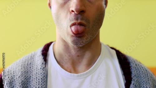Detail of a man sticking his tongue out. Joke witty conceptual game close up  photo