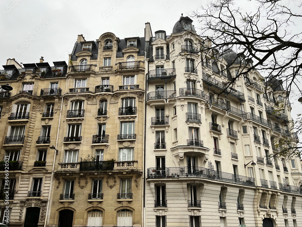 Parisian typical building facade on winter day, historical fashionable building in chic and rich quarter of the French capital city, EnrouteFrance