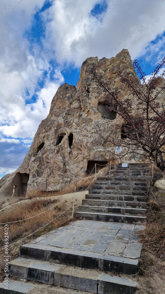 Within the Open-Air Museum of Cappadocia, a singular cave captures the essence of time, preserving stories and memories etched into its stone walls.