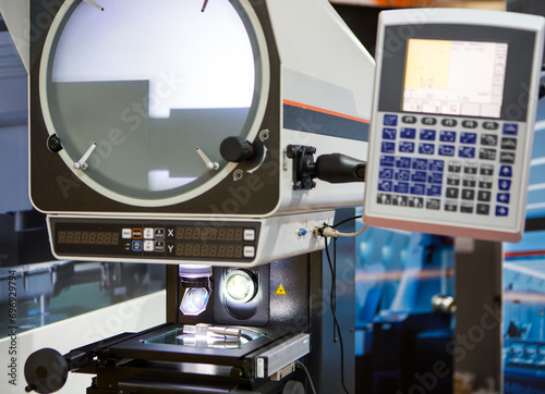 Profile projector dimension measurement machine measuring workpiece dimension in second. Industrial manufacturing